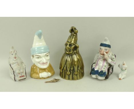 A collection of Mr Punch figurines comprising a gold charm, a Royal Worcester 'Punch', 9cm, a German bisque figurine, circa 1