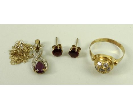 A group of jewellery comprising a 9ct gold diamond and ruby pendant, with a 9ct gold chain, a pair of garnet ear-studs, and a
