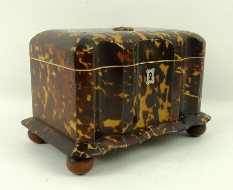 A tortoiseshell twin division tea caddy, circa 1840, with fine metal stringing, the domed top with later applied brass motif,