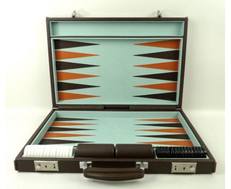 A Pickett, London, portable backgammon set, with leather playing field and hand inlaid leather points, black and white resin 