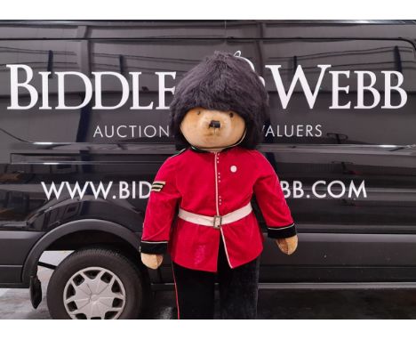 A large Merrythought Guardsman standing display teddy bear. Water damage to one leg causing seaparation of foot.