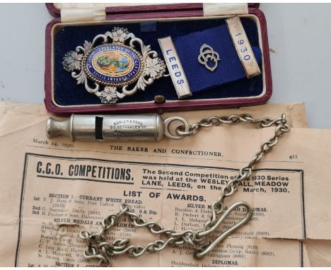 A boxed silver and enamel medal from 1930 Presented by The Central Currant Office London to AW Marsh for Currant scones toget