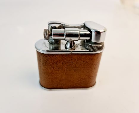 A Merlin Products (Eng) leather bound table lighter - The Cyclop.