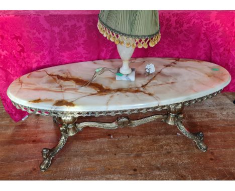 A onyx coffee table together with onyx lamp base.