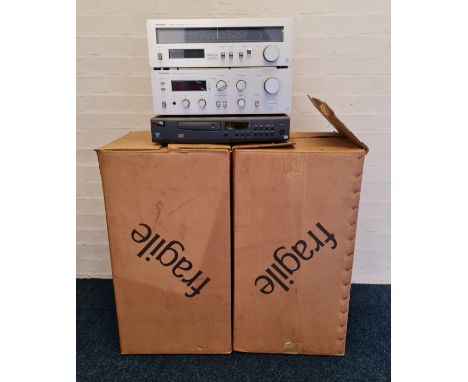 A pair of Spendor BCI loudspeakers with box and Technics tuner amplifier and Arcam Alpha 7se CD player.