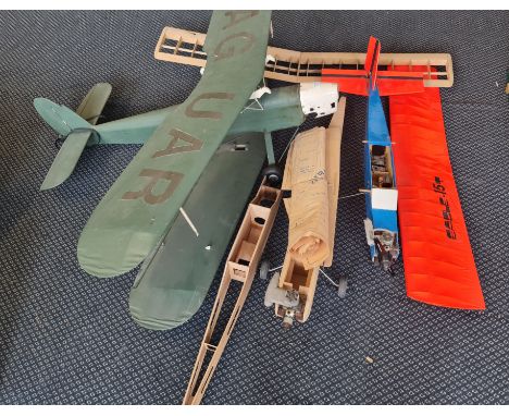 A WW1 style R/C biplane no motor together with three part built planes.