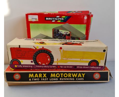 A Britains farm set Marx motorway and Nuffield tractor .