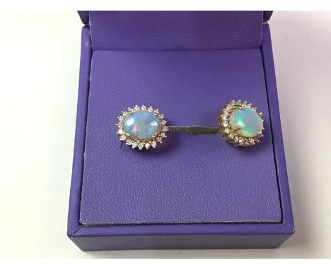 PAIR OF OPAL STUD EARRINGS,  each set with a single opal, in fourteen carat gold   General surface ware, n worn condition, so