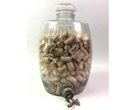 CLEAR GLASS SCOTCH BARREL, filled with corks43cm high
