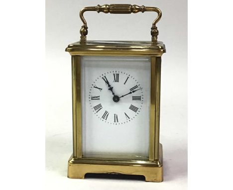 BRASS CARRIAGE CLOCK, the white enamel dial with Roman numerals14cm high overall