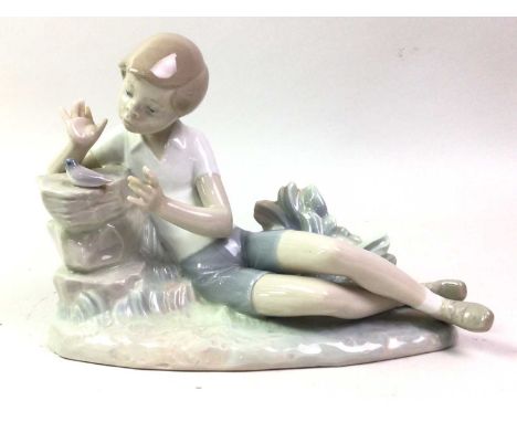 FIVE LLADRO FIGURES, comprising boy with bird, two models of rabbits, boy with boat and girl with mandolintallest 23.5cm high