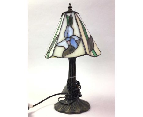 TIFFANY STYLE LAMP, 20TH CENTURY the leaded shade with floral decoration, on a splayed leaf base39cm high