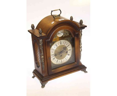 Mahogany West German mantel clock with brass and silvered dial