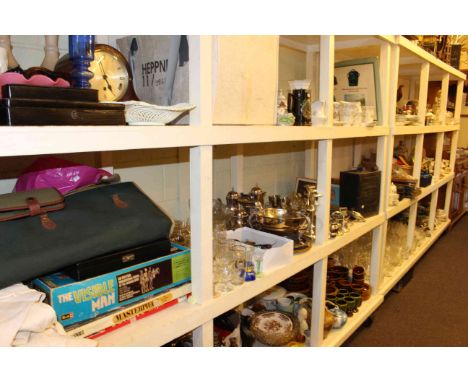 Full shelf of various teawares, games, silver plated ware, ESSO petrol can, linen, glassware, etc