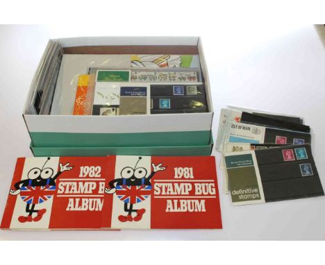 Box of presentation packs and first day covers