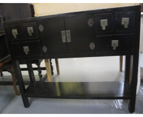 Modern Chinese design ebonised side or console table with an arrangement of drawers and under tier.  Length 95cm approx.  (B.