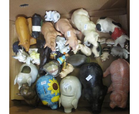 Box of pig ornaments to include: ceramic pigs, piggy banks, glass, Wade whimsy, shell, carved Kauri wood by Markocraft etc.(B