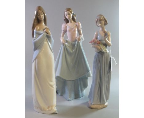 Three Nao Spanish porcelain figurines of young girls with a basket of flowers, crinoline dress etc.  (3)  (B.P. 21% + VAT) 