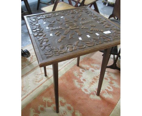 'Arts and Crafts' design oak lamp table, the top carved with fruits and foliage and dated 1898.  (B.P. 21% + VAT) 