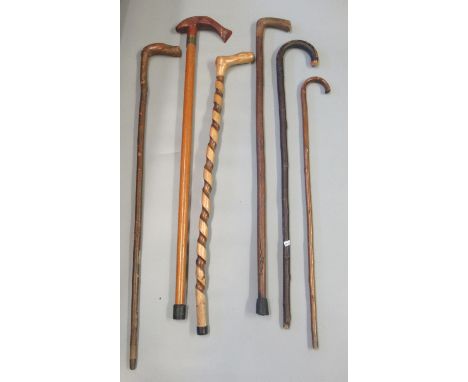 Bundle of six walking sticks to include; spirally turned and a stick with a salmon shaped handle. (6) (B.P. 21% + VAT)