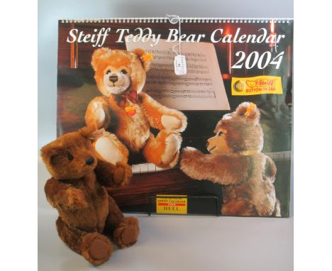 Steiff 'The Artist's Bear'.  Dark brown, 27cm approx.  In original box with COA, together with a Steiff Teddy Bear Calendar d