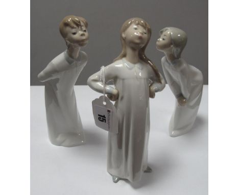 Three Lladro Pottery Figure's, of children in night dresses, the tallest 20cm.