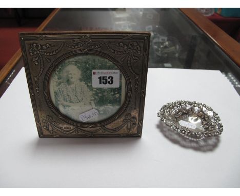A Hallmarked Silver Mounted Photograph Frame, with circular aperture, on wooden easel back; together with a hallmarked silver