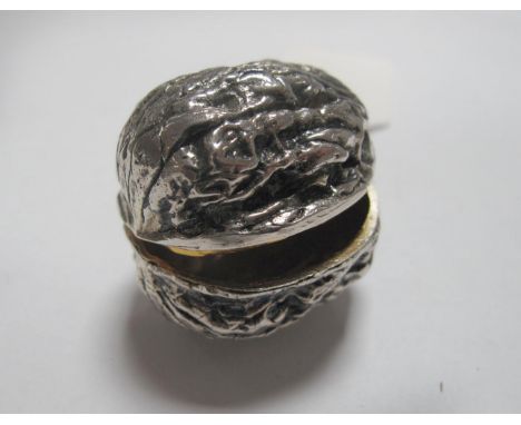 A Novelty Pill/Trinket Box as a Walnut, 4cm wide.