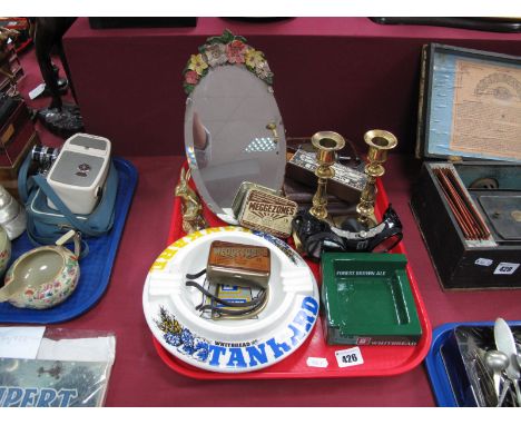 An Oval Bevelled Barbola Easel Mirror, advertising tins and brewery ashtray's, brass candlesticks, micrometre etc:- One Tray