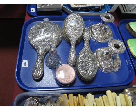 Decorative Hair Brushes, a hand mirror, allover detailed in relief, a pair of dwarf candlesticks, circular trinket box and a 