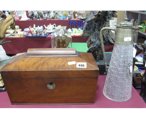 A XIX Century Mahogany Sarcophagus Shaped Tea Caddy; together with a XIX Century claret jug, decorated with a shield Queen Vi