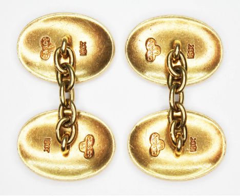 A pair of oval cufflinks, sponsor 'C&amp;S Co. Ld.' and also marked '18ct', the ovals measuring approx. 17mm x 12mm, wt. 13.9