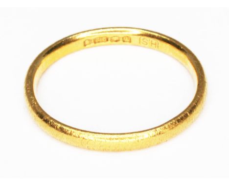 A hallmarked 22ct gold wedding band, wt. 2.1g, size K.  