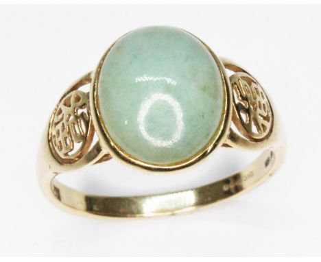 A jadeite jade cabochon ring, 14ct gold import marks, gross wt. 4.2g, size U.  
