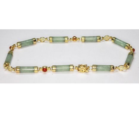A jadeite jade bracelet, marked '14K', length 22cm, gross wt. 8g.  