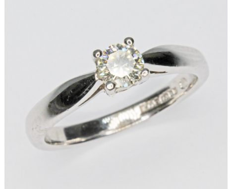 A diamond solitaire ring, the round brilliant cut stone weighin approx. 0.23ct, hallmarked 18ct white gold band, gross wt. 3g