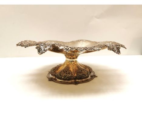 A Victorian Robert Garrard II repousse silver pedestal dish with scalloped foliate design edge and shell motifs to the pedest