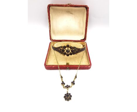 A boxed Victorian Bohemian yellow metal rose cut garnet floral design bangle along with a gold plated silver floral design pe