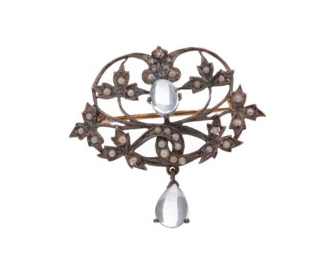 TOPAZ, PEARL AND DIAMOND BROOCH,of openwork form, with two cabochon topaz stones, the border set with seed pearls beneath fiv