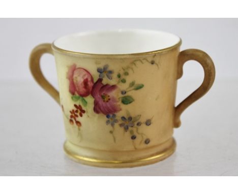 A ROYAL WORCESTER MINIATURE PORCELAIN TWO-HANDLED TANKARD, hand painted and gilded floral decoration on a blush ivory ground,