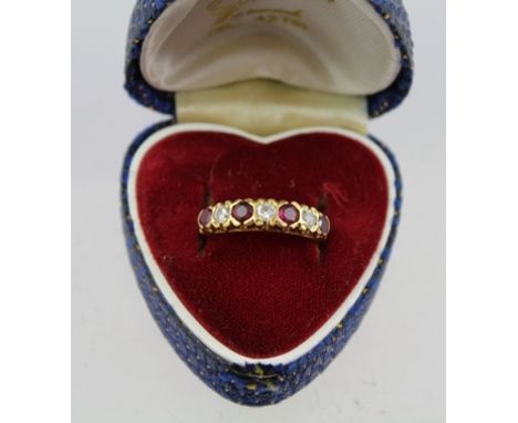 A RUBY AND DIAMOND SET LADY'S RING with yellow metal band 