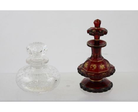 A 19TH CENTURY RUBY GLASS SCENT BOTTLE with stopper, gilded decoration, 15cm high, together with one other SCENT BOTTLE with 