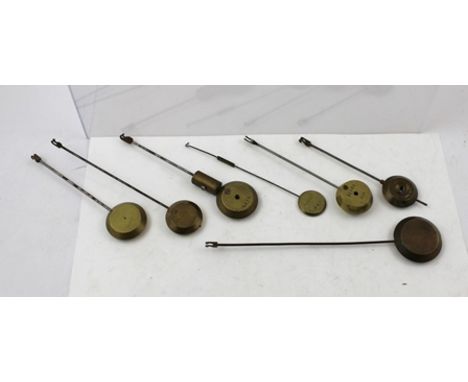 A COLLECTION OF EIGHT VARIOUS CLOCK PENDULUMS 