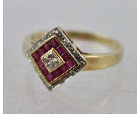 A RUBY AND DIAMOND SET GOLD COLOURED METAL DRESS RING, having square top, central diamond, bordered with calibre rubies and d