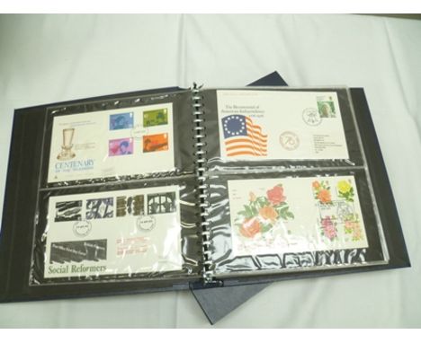 A BENHAM FIRST DAY COVER ALBUM (blue) WITH SLIP CASE dates 1975-1981 containing over 60 covers including; The Royal Family, 5