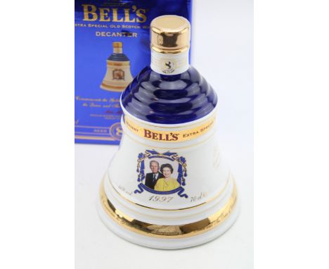 Boxed Bells Extra Special Old Scotch Whisky, Aged 8 Years, 1997, in a Wade decanter, 70cl, sealed and unopened.