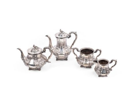 A large and impressive Victorian silver tea set, comprising teapot, hot-water pot, twin handled sugar bowl and jug, decorated