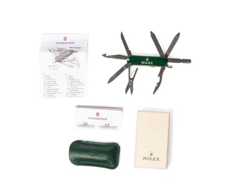 A Rolex, Victorinox, Swiss Army, MiniChamp penknife, in green with Rolex insignia, with Rolex stamped green leather pouch and