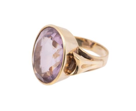 A 14ct gold and amethyst dress ring, the oval cut amethyst of approximately 14.4 by 18.4mm, ring size K, total weight 9.5g.