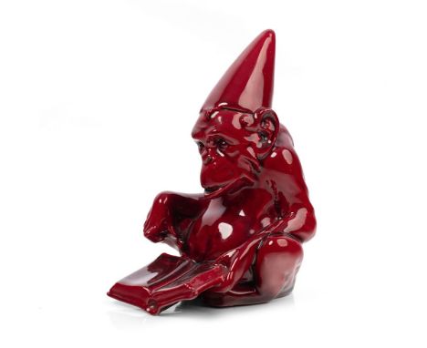 Rare Royal Doulton flambe figure of The Dunce, HN972, a gorilla wearing a dunce hat reading a book, 14.5cm tall. Generally go